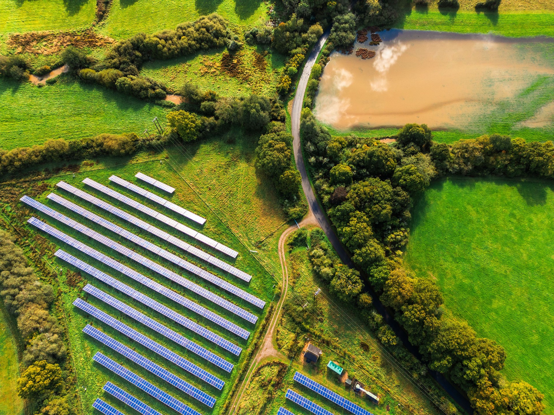 Aerial view of solar farm in rural landscape